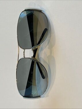 Prada Aviator Sunglasses with Black and Cream temples.
